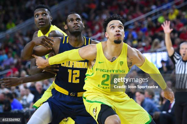 Oregon forward Dillon Brooks boxes out for a rebound during the semifinal game of the Pac-12 Tournament between the Oregon Ducks and the California...