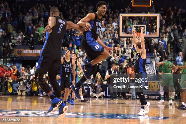 Harry Giles, Matt Jones and Luke Kennard of the Duke Blue Devils celebrate following their 75-69 victory against the Notre Dame Fighting Irish during...