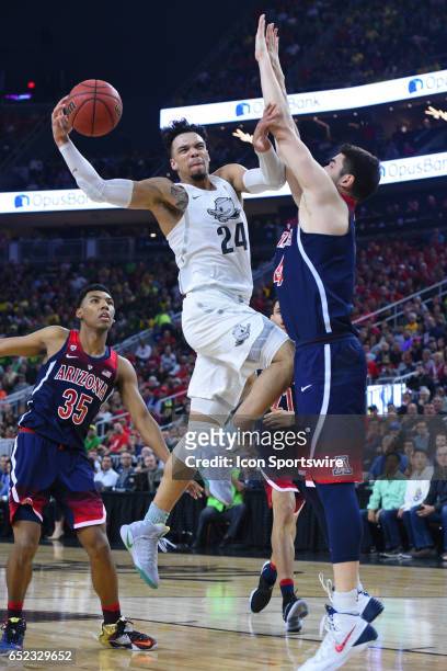Oregon forward Dillon Brooks drives to the basket and is fouled during the championship game of the Pac-12 Tournament between the Oregon Ducks and...