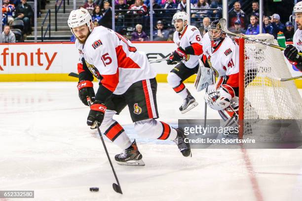 Ottawa Senators Left Wing Zack Smith skates with the puck as Ottawa Senators Goalie Craig Anderson and Ottawa Senators Defenseman Chris Wideman look...