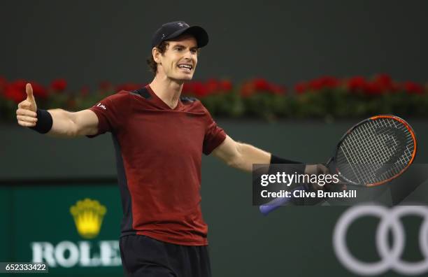 Andy Murray of Great Britain shows his frustration during his straight sets defeat by Vasek Pospisil of Canada in their second round match during day...
