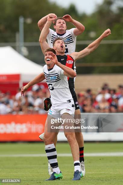 Patrick Dangerfield of the Cats gets above his opponent during the JLT Community Series AFL match between the Geelong Cats and the Essendon Bombers...