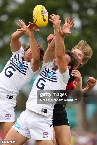 Tom Hawkins of the Cats contests the ball in the air during the JLT Community Series AFL match between the Geelong Cats and the Essendon Bombers at...