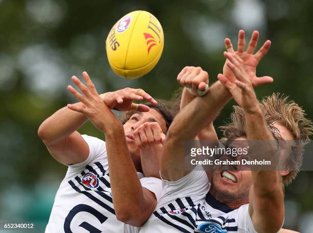 Tom Hawkins of the Cats contests the ball in the air during the JLT Community Series AFL match between the Geelong Cats and the Essendon Bombers at...