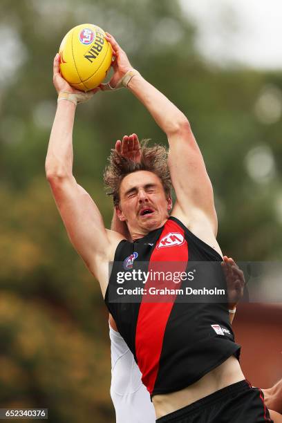 Joe Daniher of the Bombers takes a mark during the JLT Community Series AFL match between the Geelong Cats and the Essendon Bombers at Queen...