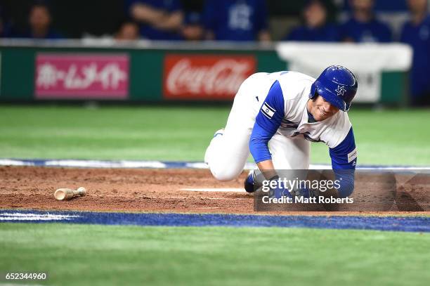 Sam Fuld of Israel falls in the seventh inning during the World Baseball Classic Pool E Game One between Cuba and Israel at Tokyo Dome on March 12,...