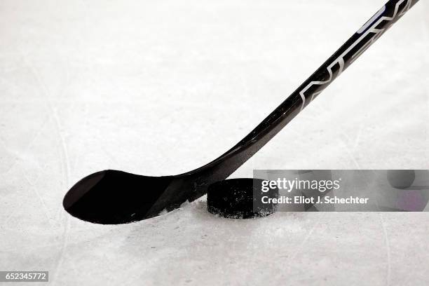 Puck and stick at the ready during warm ups between the visiting Minnesota Wild and the Florida Panthers at the BB&T Center on March 10, 2017 in...