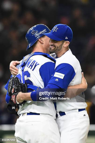 Catcher Ryan Lavarnway of Israel and pitcher Josh Zeid of Israel celebrate after winning the World Baseball Classic Pool E Game One between Cuba and...