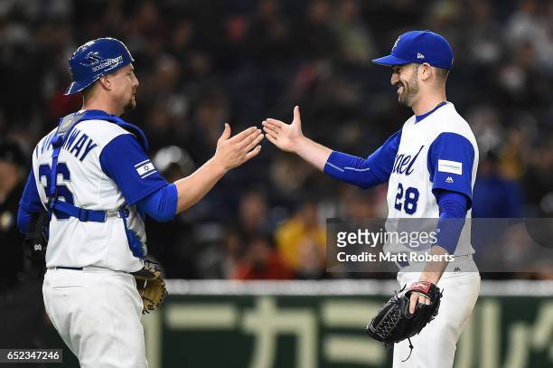 Catcher Ryan Lavarnway of Israel and pitcher Josh Zeid of Israel celebrate after winning the World Baseball Classic Pool E Game One between Cuba and...
