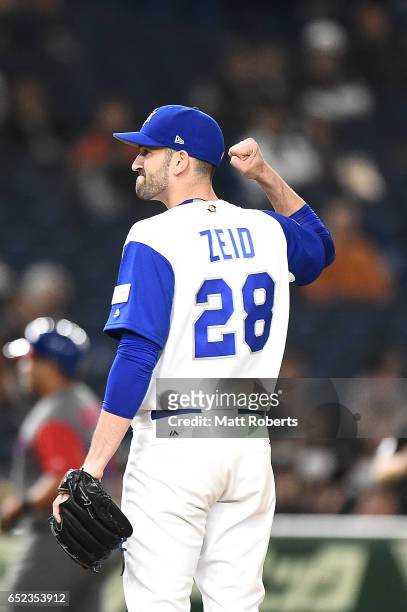Pitcher Josh Zeid of Israel reacts after finishing the eighth inning during the World Baseball Classic Pool E Game One between Cuba and Israel at...