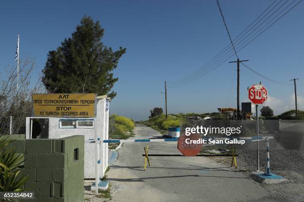 Sign on the southern, Greek side of the island warns of the beginning of a militarized portion of the Turkish Republic of North Cyprus along the...
