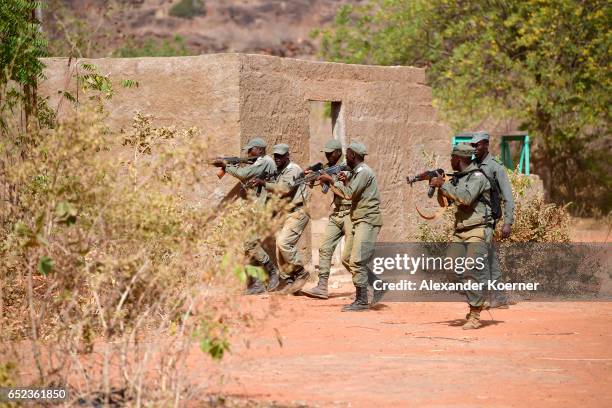 Soldiers of the Malian Armed Forces march during a tactical training session at a training base on March 09, 2017 in Koulikoro, Mali. The training is...