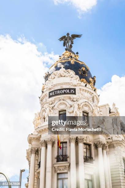 metropolis traditional building in madrid, spain - madrid stock pictures, royalty-free photos & images