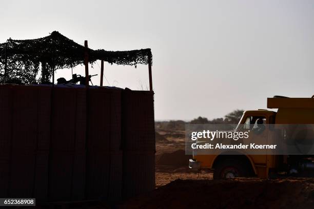 Local worker enter Camp Castor during sunrise on March 6, 2017 in Gao, Mali. U.N.-led MINUSMA troops are assisting the Malian government in its...