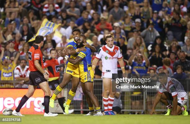Semi Radradra of the Eels celebrates scoring a try with team mate Michael Jennings during the round two NRL match between the St George Illawarra...
