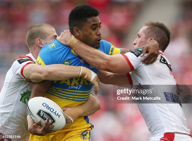 Michael Jennings of the Eels is tackled by Josh McCrone of the Dragons during the round two NRL match between the St George Illawarra Dragons and the...