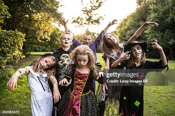 children pose in zombie costumes for halloween night - zombie girl ストックフォトと画像