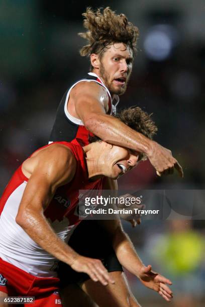 Tom Hickey of the Saints and Kurt Tippett of the Swans compeyte in the ruck during the JLT Community Series AFL match between the St Kilda Saints and...