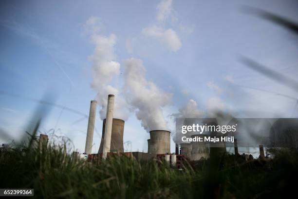 Steam rises from cooling towers at the Niederaussem coal-fired power plant of RWE Power AG on March 11, 2017 near Bergheim, Germany. Energy policy is...