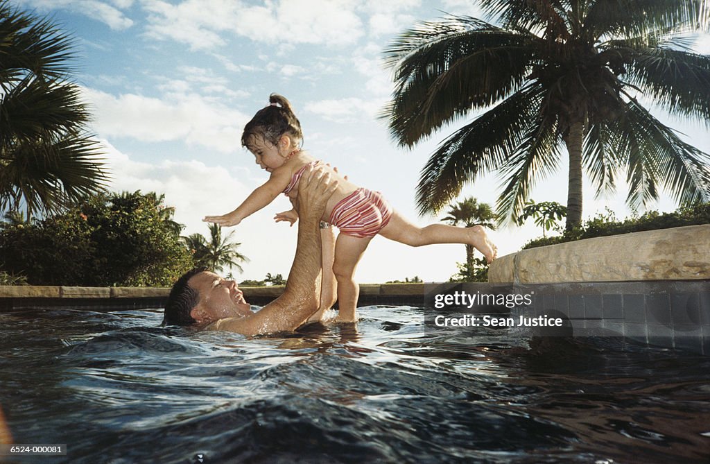 Father with Daughter in Pool