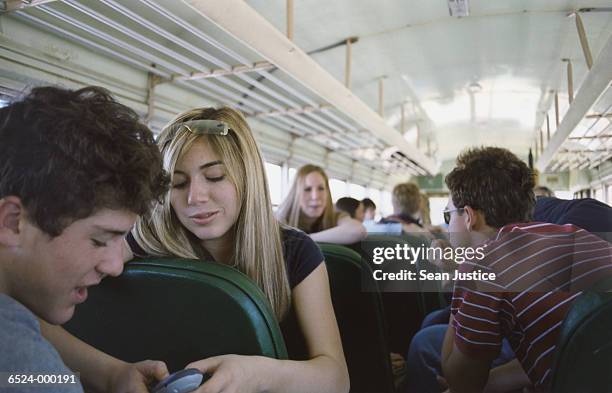 high school students on bus - school bus stock photos et images de collection