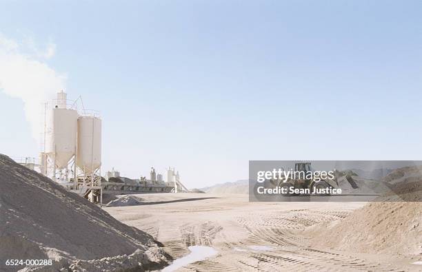 excavator at cement plant - cement factory stock pictures, royalty-free photos & images