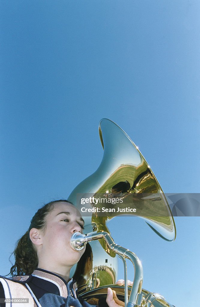 Girl Playing Brass Instrument High-Res Stock Photo - Getty Images