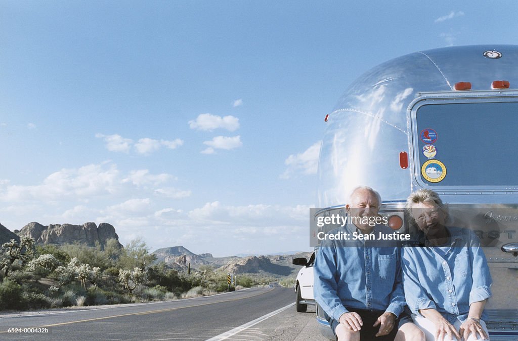Couple outside Trailer Home