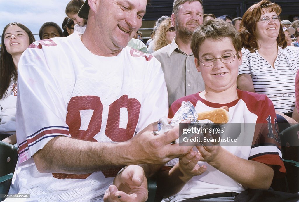 Father and Son with Hot Dogs