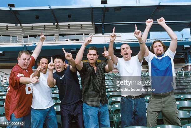 sports spectators pointing - baseball crowd stock-fotos und bilder