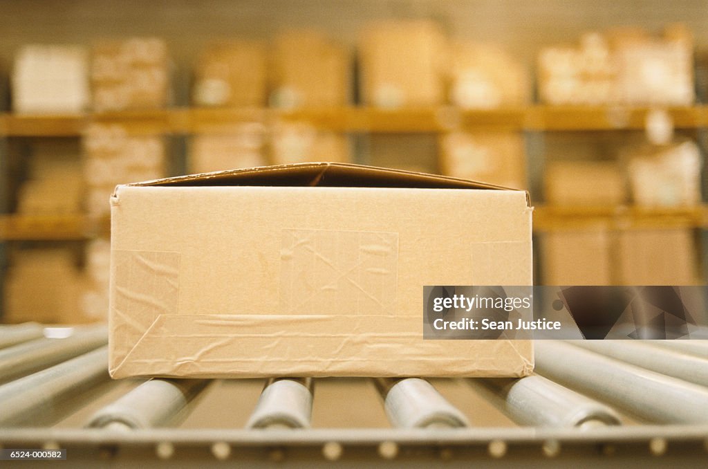 Box on Conveyor in Warehouse