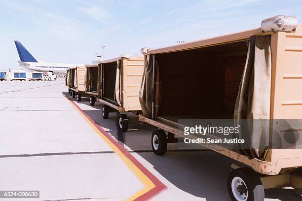 empty luggage carts - southwest plane stock pictures, royalty-free photos & images