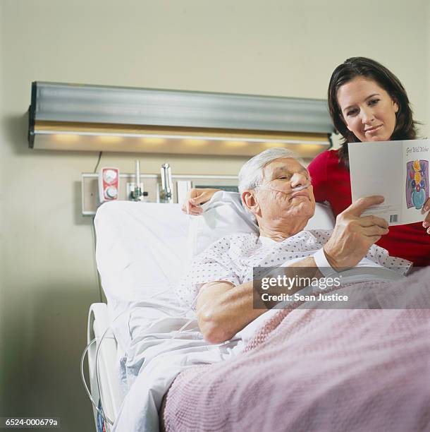 Patient Reading Reference Patient Reading A Card Photos and Premium High Res Pictures - Getty Images