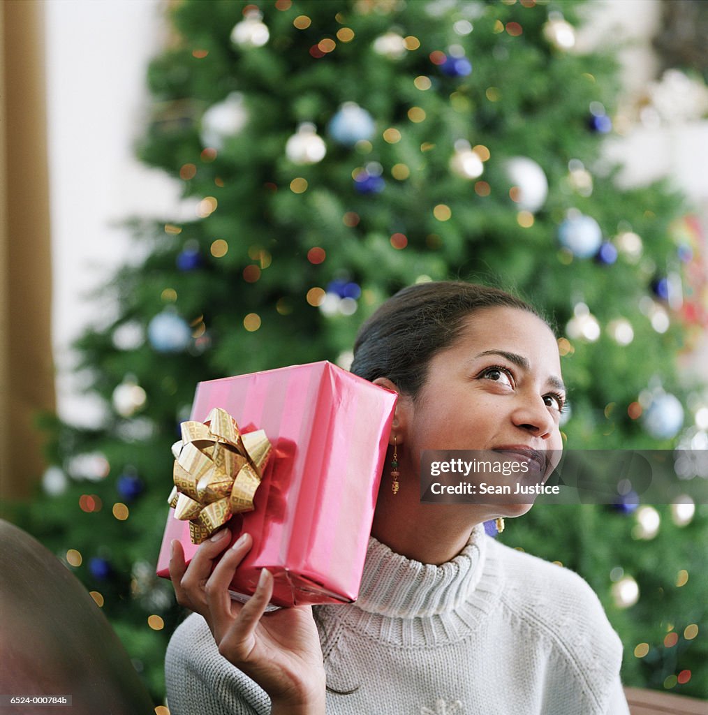 Woman Shaking Present