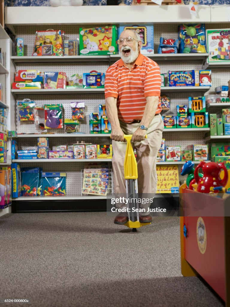 Elderly Man using Pogo Stick