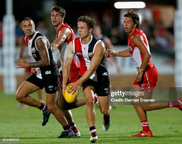 Jack Billings of the Saints runs with the ball during the JLT Community Series AFL match between the St Kilda Saints and the Sydney Swans at...