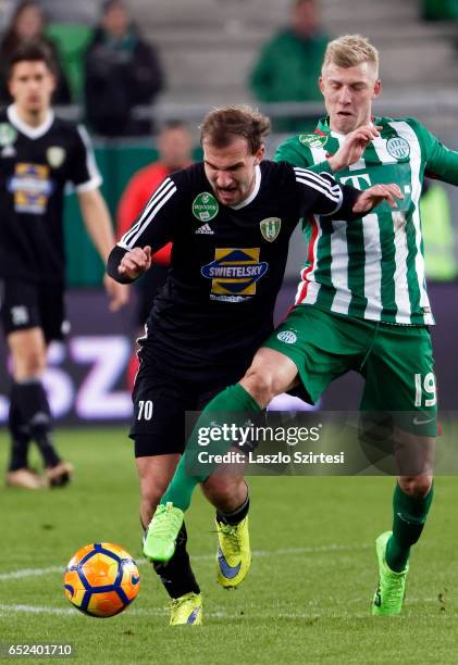 Julian Koch of Ferencvarosi TC fouls Andras Jancso of Swietelsky Haladas during the Hungarian OTP Bank Liga match between Ferencvarosi TC and...