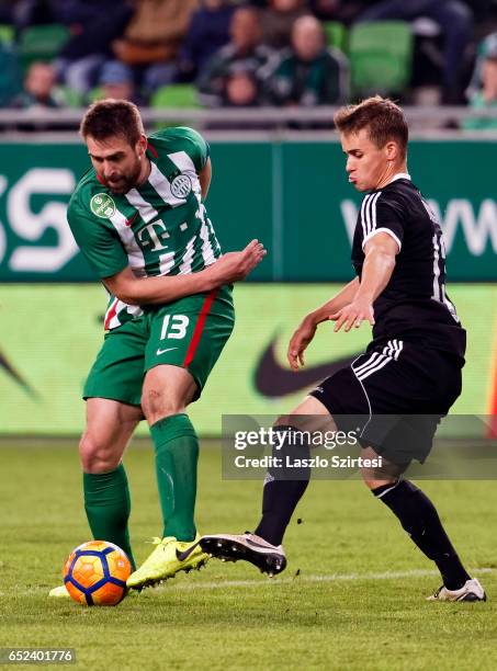 Daniel Bode of Ferencvarosi TC dribbles next to Kristof Polgar of Swietelsky Haladas during the Hungarian OTP Bank Liga match between Ferencvarosi TC...