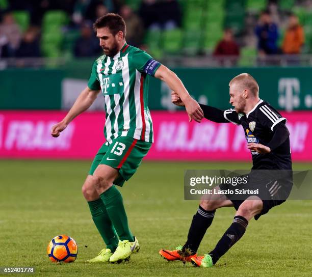 Lorant Kovacs of Swietelsky Haladas tries to pull Daniel Bode of Ferencvarosi TC during the Hungarian OTP Bank Liga match between Ferencvarosi TC and...