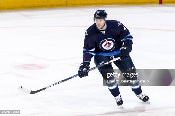 Paul Postma of the Winnipeg Jets follows the play up the ice during first period action against the Pittsburgh Penguins at the MTS Centre on March 8,...