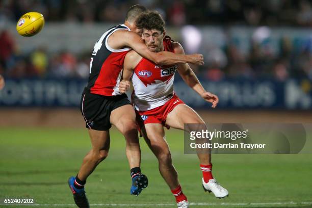Nathan Wright of the Saints collides with Robbie Fox of the Swans during the JLT Community Series AFL match between the St Kilda Saints and the...