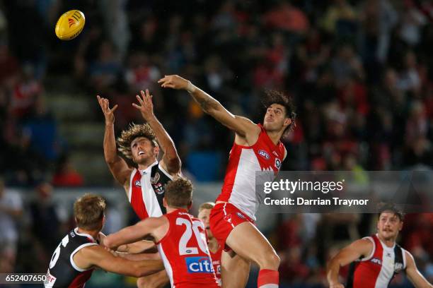 Tom Hickey of the Saints and Sam Naismith of the Swans compete in the ruck during the JLT Community Series AFL match between the St Kilda Saints and...