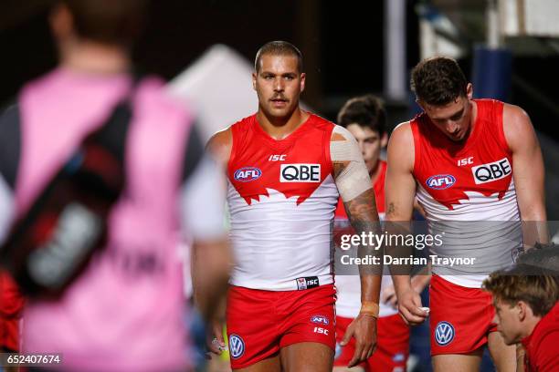 Lance Franklin of the Swans takes a rest on the interchange bench during the JLT Community Series AFL match between the St Kilda Saints and the...