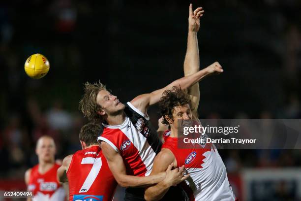 Jimmy Webster of the Saints spoils Kurt Tippett of the Swans during the JLT Community Series AFL match between the St Kilda Saints and the Sydney...