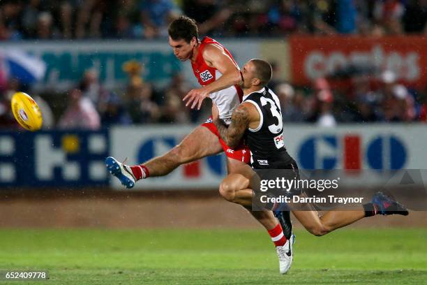 Sam Naismith of the Swans is tackled by Nathan Wright of the Saints during the JLT Community Series AFL match between the St Kilda Saints and the...