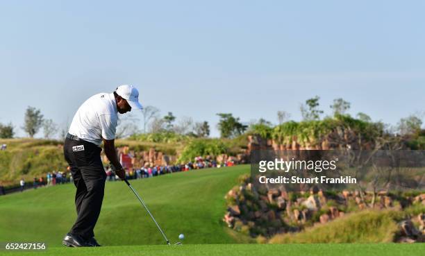 Chawrasia of India plays his approach shot on the 17th hole during the final round of the Hero Indian Open at Dlf Golf and Country Club on March 12,...