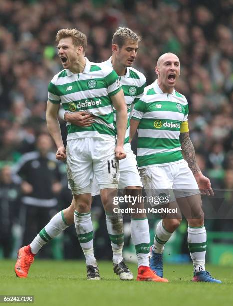 Stuart Armstrong of Celtic celebrates scoring his sides first goal with his Celtic team mates during the Ladbrokes Scottish Premiership match between...