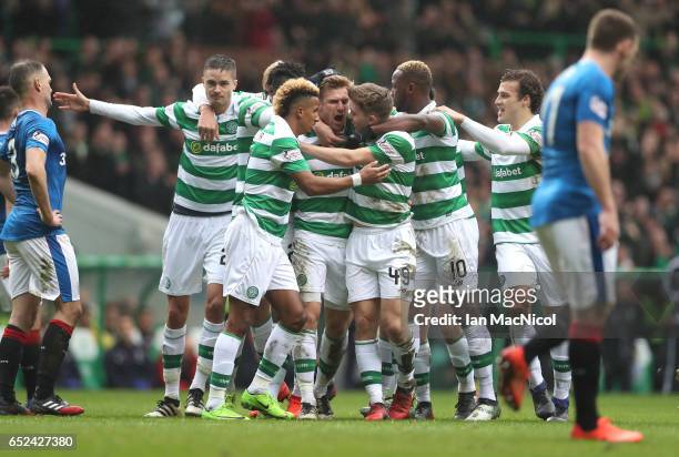 Stuart Armstrong of Celtic celebrates scoring his sides first goal with his Celtic team mates during the Ladbrokes Scottish Premiership match between...