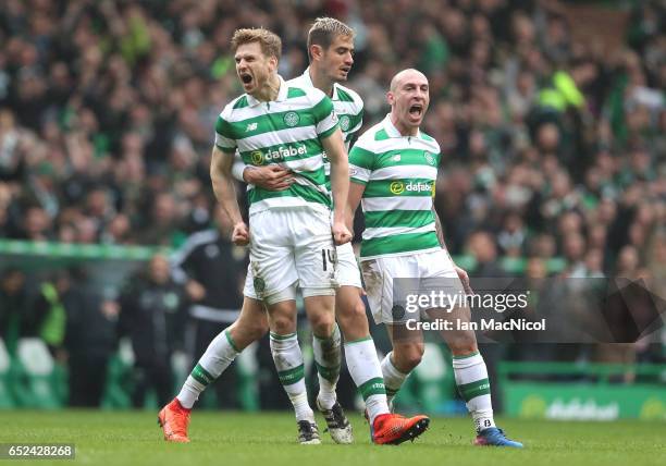 Stuart Armstrong of Celtic celebrates scoring his sides first goal with his Celtic team mates during the Ladbrokes Scottish Premiership match between...