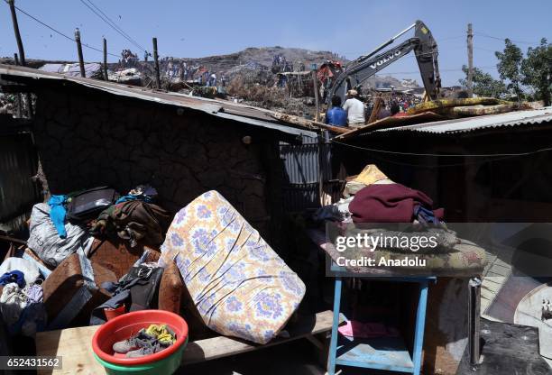 View of a house damaged by a landslide that swept through a massive garbage dump, killing at least 10 people and leaving several missing at Koshe...